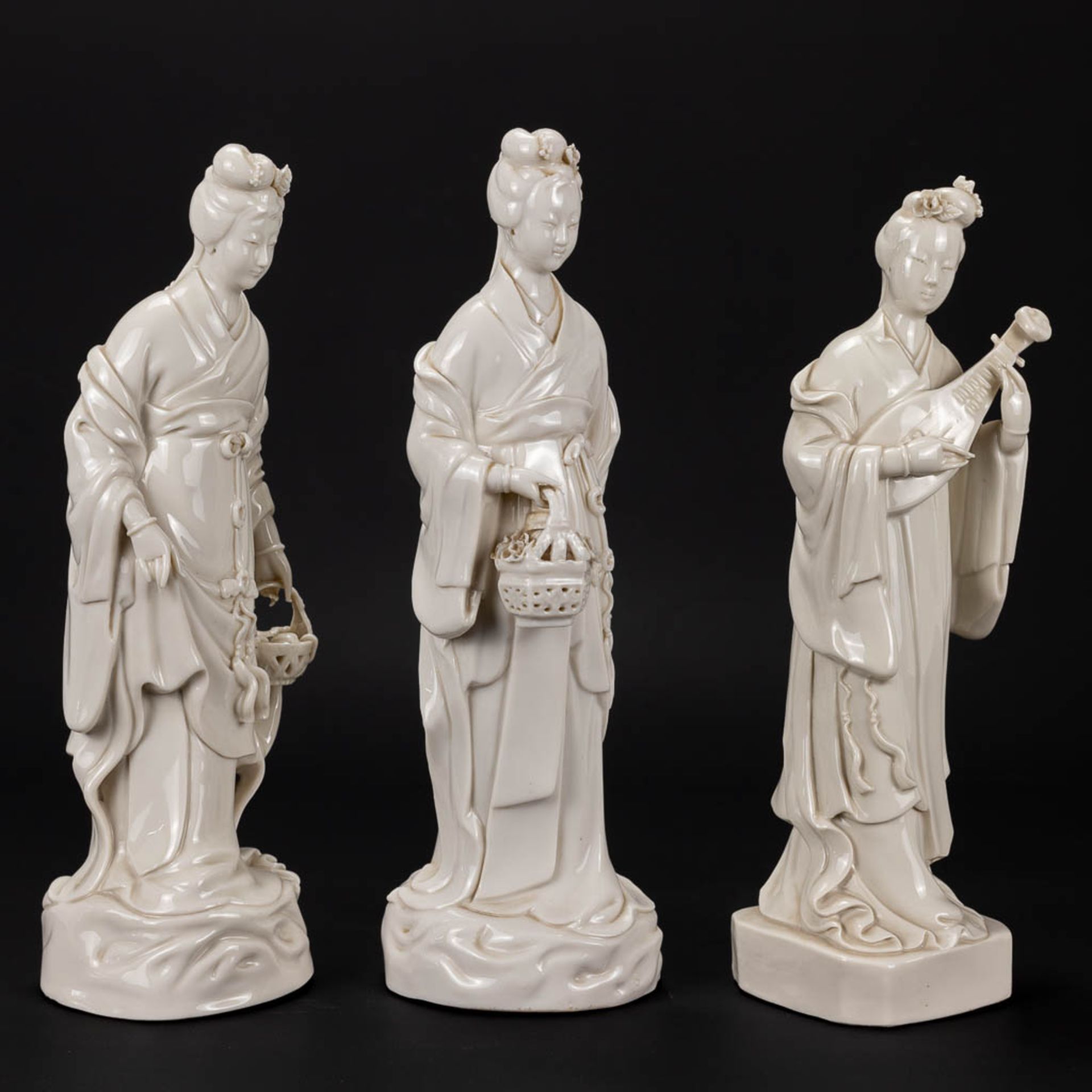 A collection of 3 female figurative statues 'Blanc De Chine' made of Chinese porcelain. - Image 12 of 16