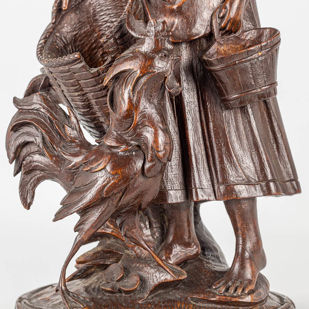 A wood sculpture of a lady with rooster, Black Forest. - Image 12 of 14