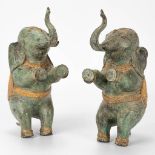 A pair of decorative elephants made of bronze and made in Thailand.