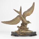 A statue of a seagull made of spelter in art deco style and marked Hauterive