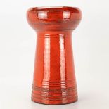 A mid-century ceramic vase with red glaze and marked EL for Emiel Laskaris.
