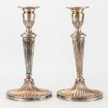 A pair of silver candlesticks marked DJS, D J Silver Repairs, 1966.