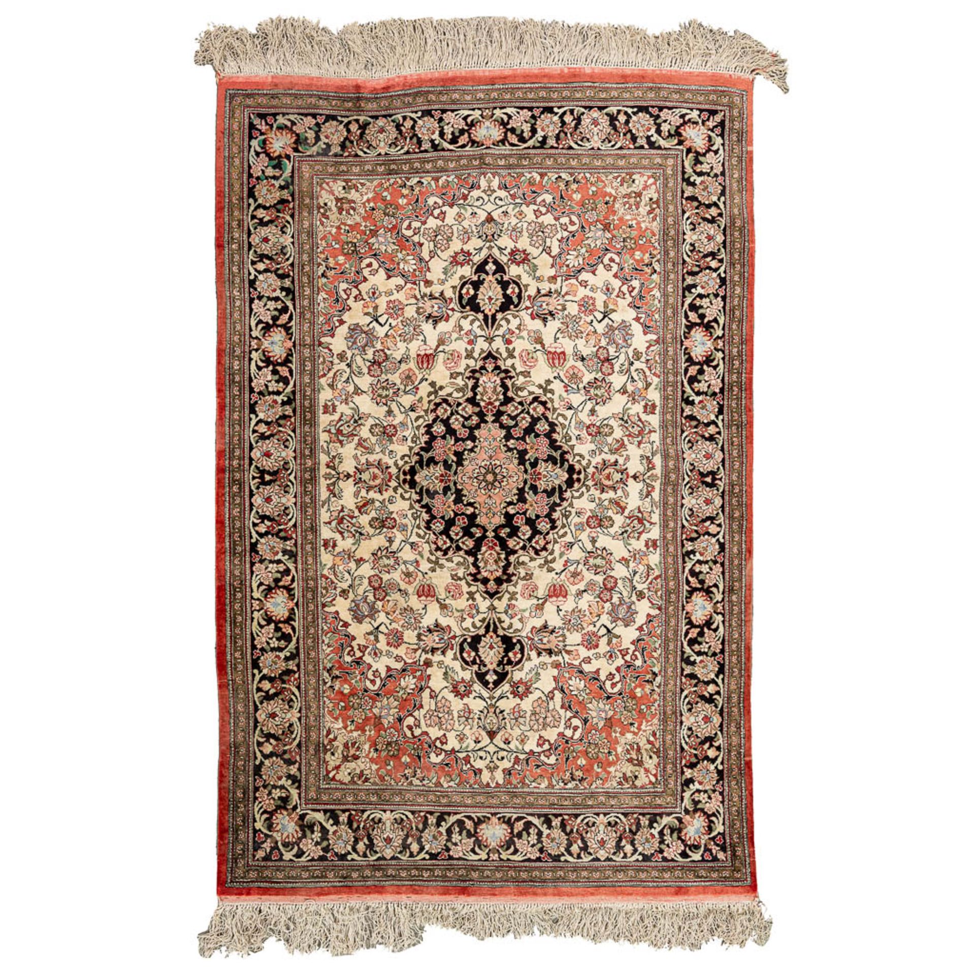 An Oriental hand-made carpet, Kirman. Made with silk. (103 x 158 cm)