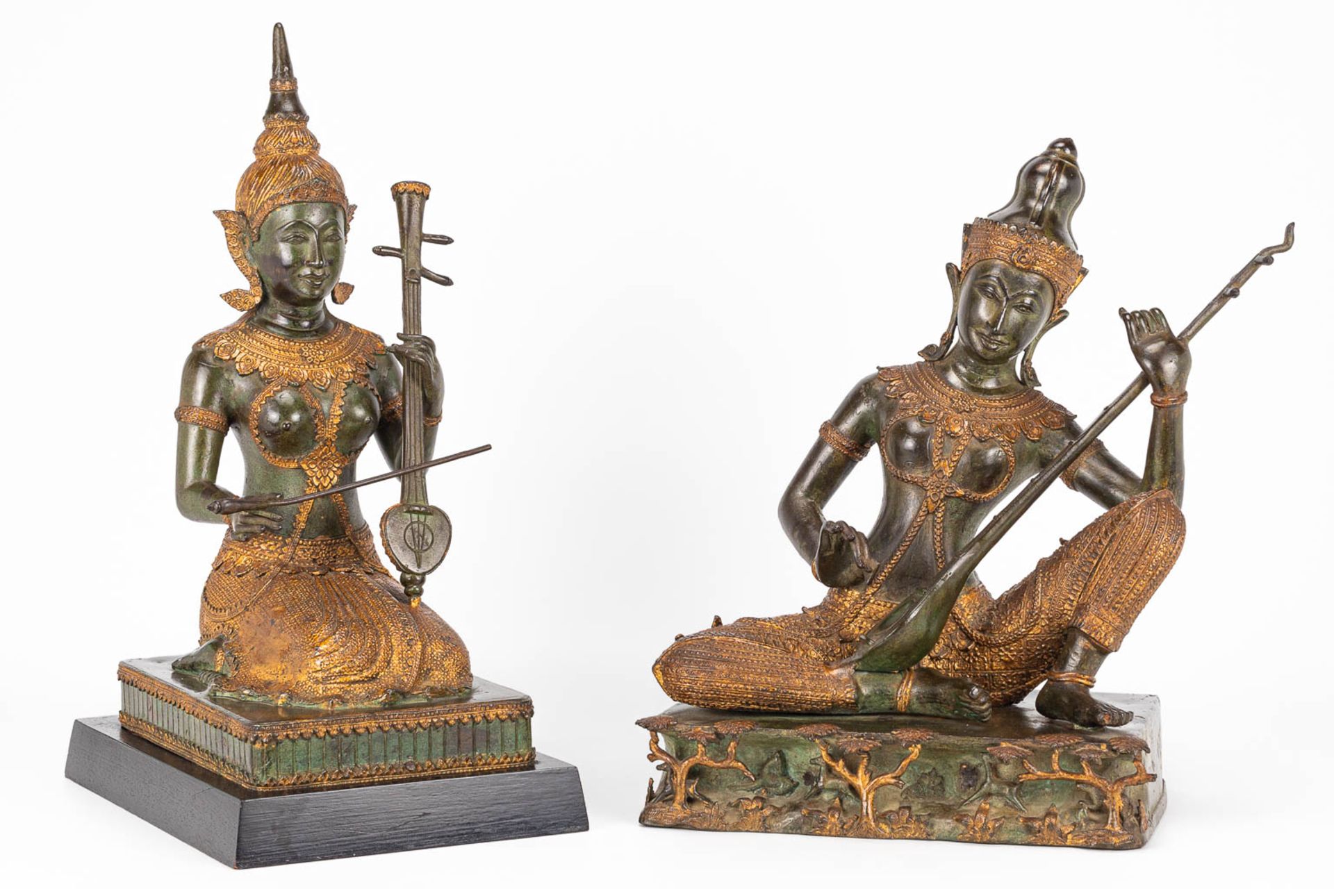 A collection of 2 oriental musical buddha's, made of metal. - Image 6 of 15