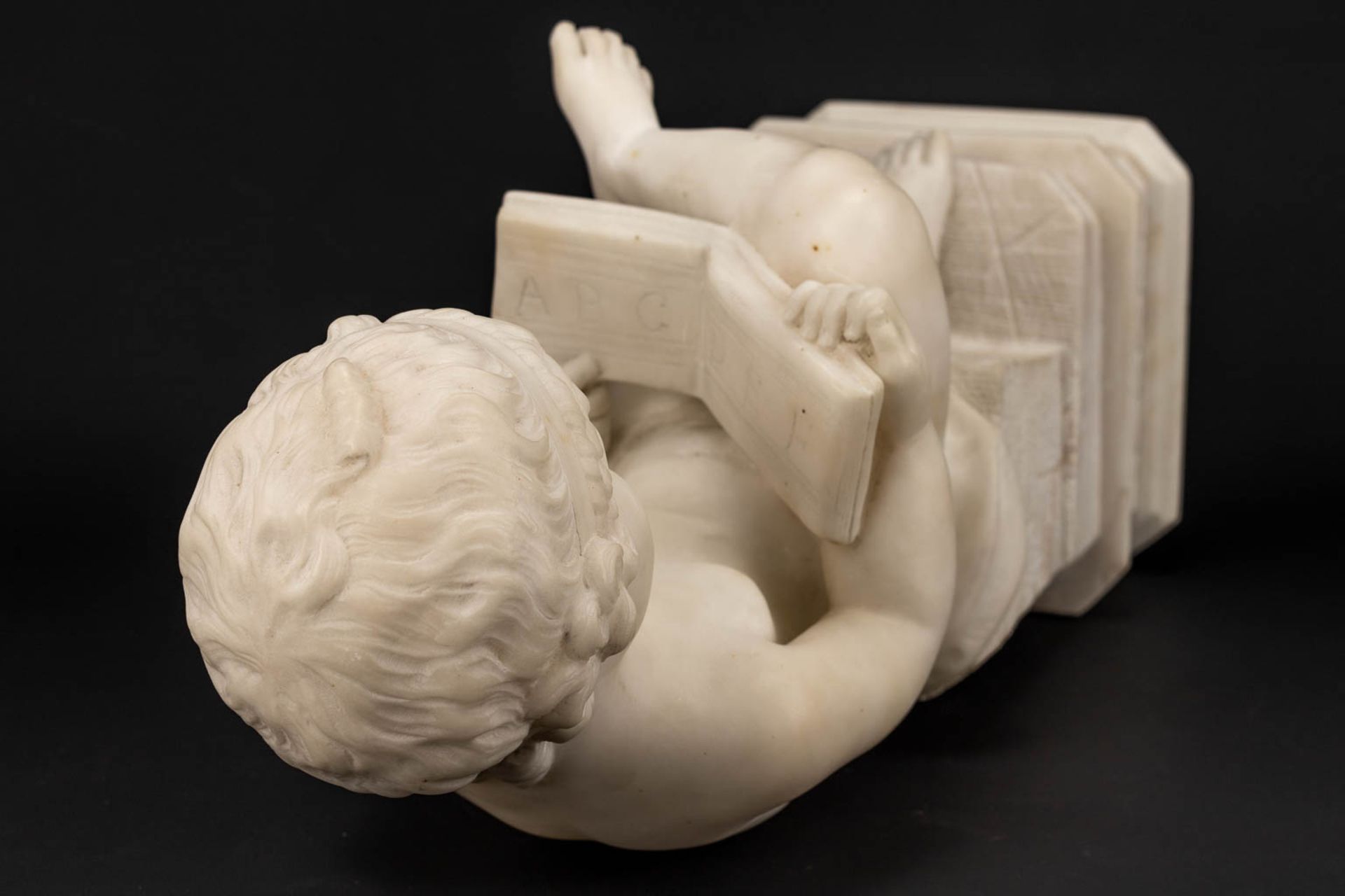 A statue of a reading boy made of alabaster. - Image 11 of 11