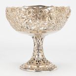 A tazza made of silver and decorated with putti. 248g