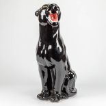 A ceramic statue of a black panther. Made in Italy.