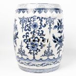 A garden stool made of Chinese porcelain and decorated with blue-white flowers.