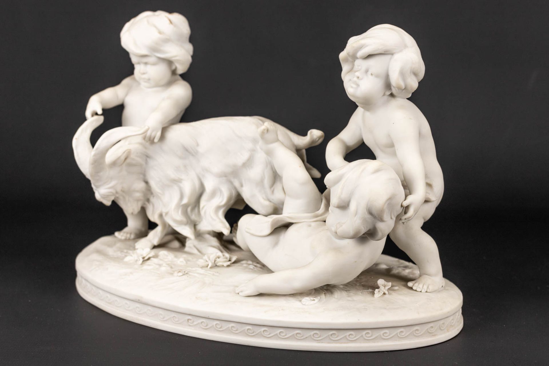A group of kids and a goat made of biscuit porcelain and marked Richard Eckert& Co, Volkstedt. - Image 10 of 15