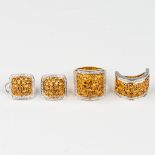 A group of 2 earrings, a ring and bracelet 'Lucky Charm' decorated with probably Topaz and diamonds,