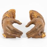 A pair of wood sculptured hands.