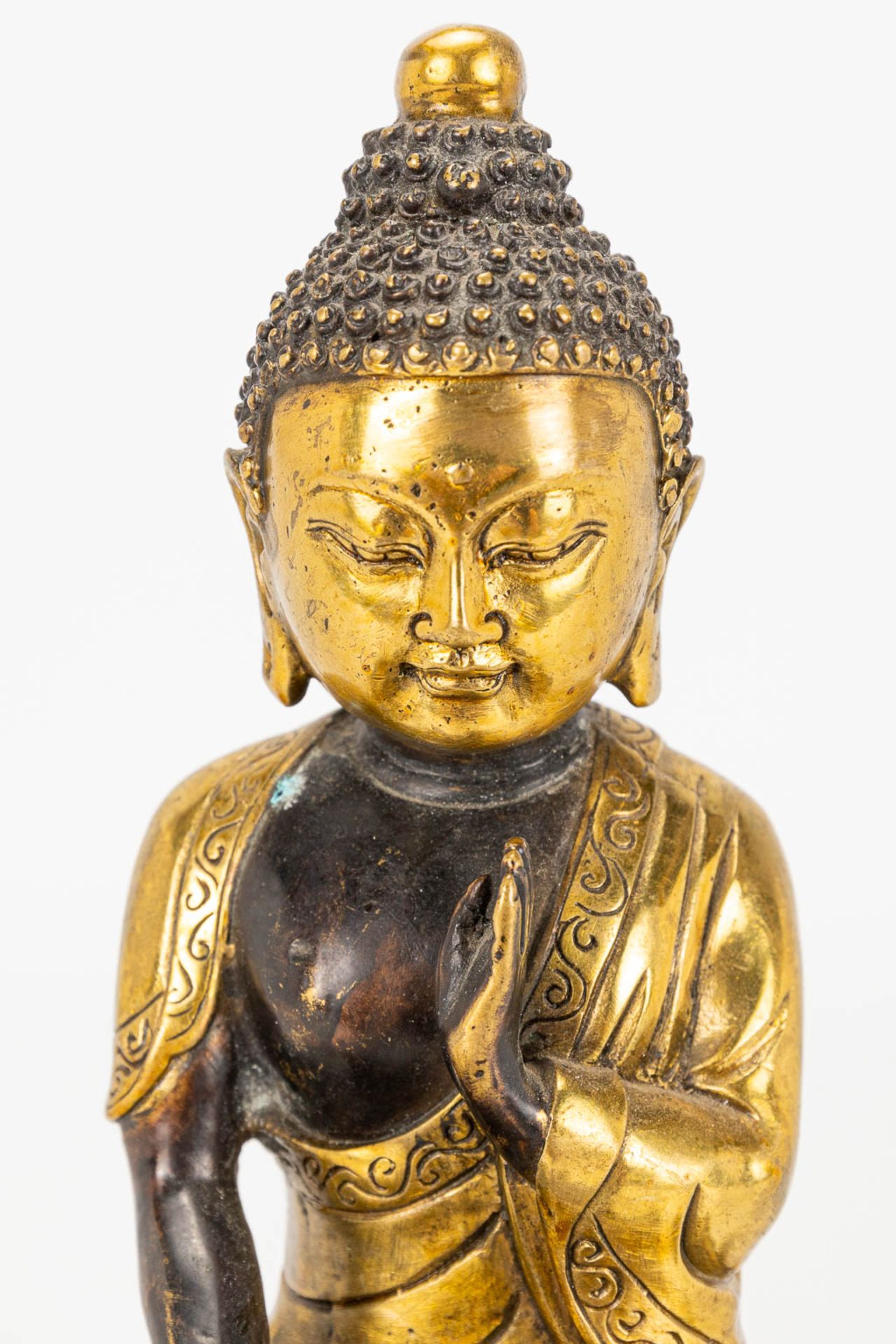 A Buddha on a lotus flower made of bronze. - Image 10 of 11