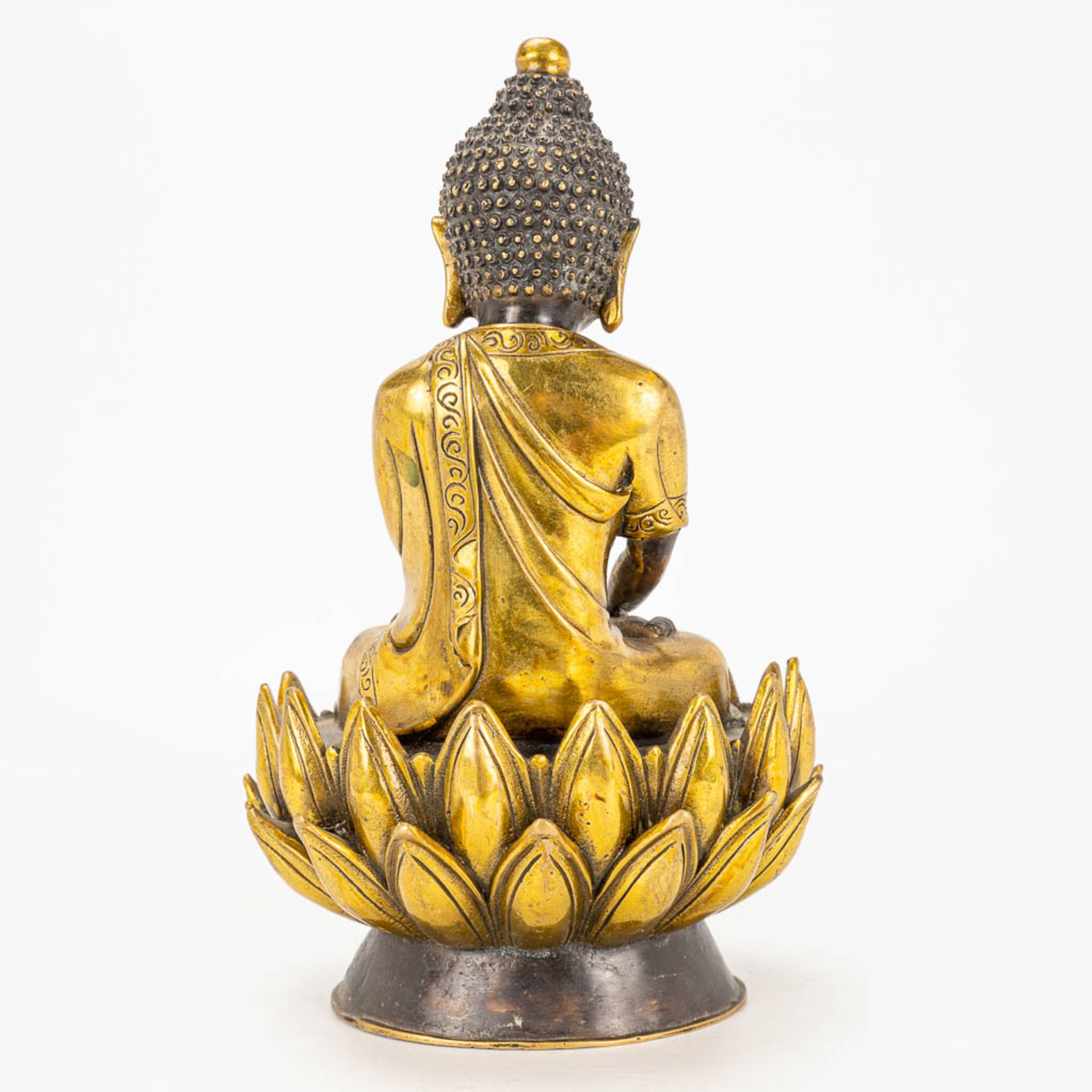 A Buddha on a lotus flower made of bronze. - Image 8 of 11