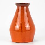 A mid-century vase with orange glaze, in the style of Amphora, Perignem.