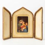 A miniature painting after 'Madonna della Seggiola by Rafael', painted on porcelain in a leather tri
