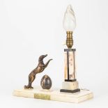 A lamp with a dog and marble egg, made of onyx and bronze, art deco style.