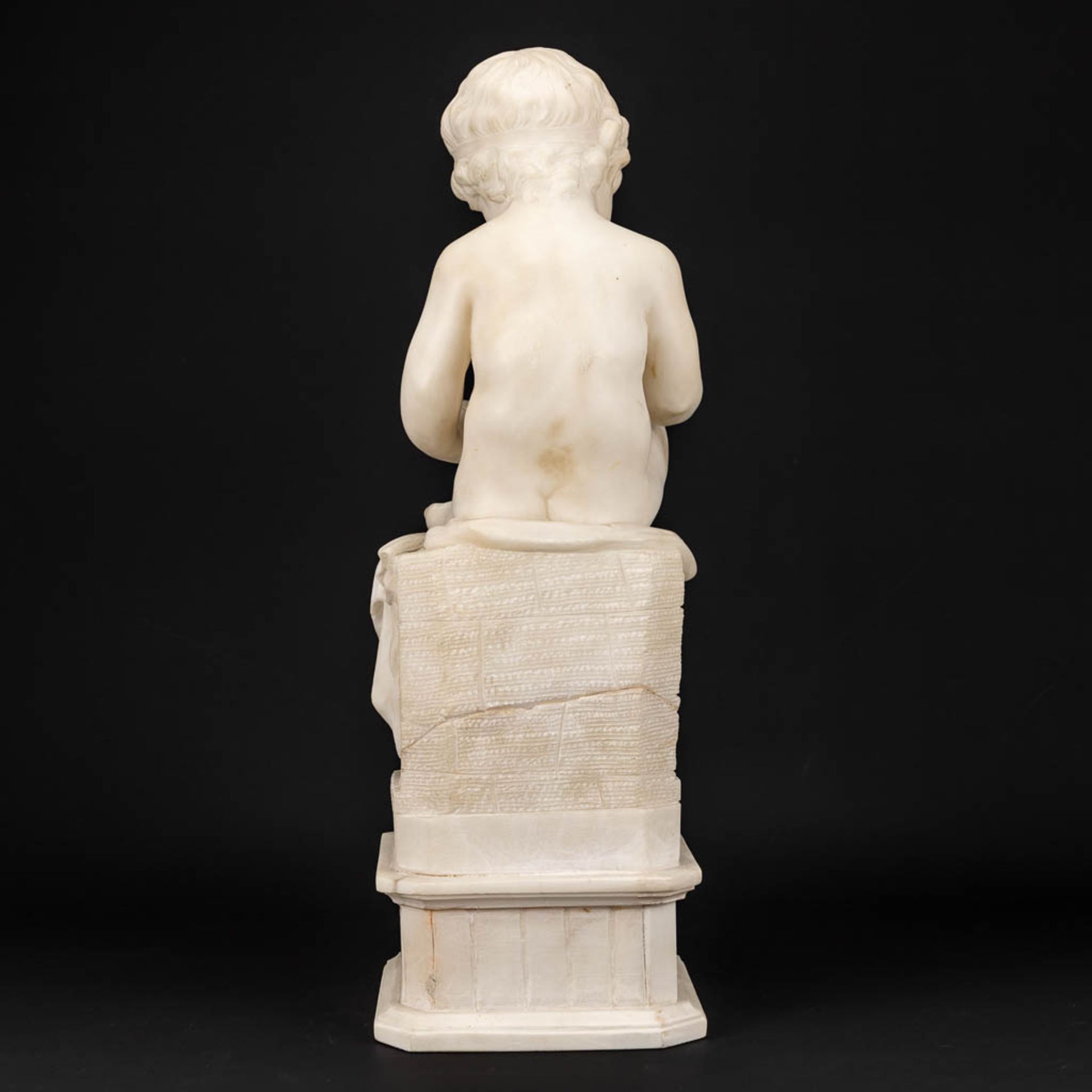 A statue of a reading boy made of alabaster. - Image 10 of 11