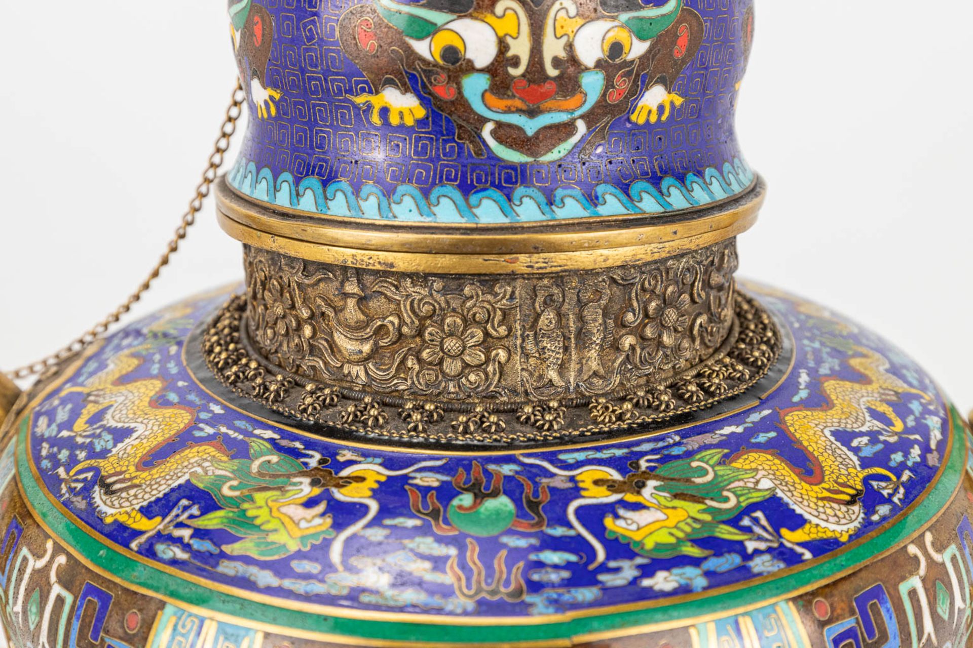 A Tibetan ceremonial ewer made of gilt bronze and finished with cloisonnŽ bronze. - Image 16 of 18