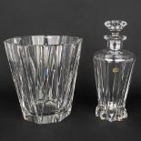 A champagne bucket and decanter made of crystal made by Val Saint-Lambert.