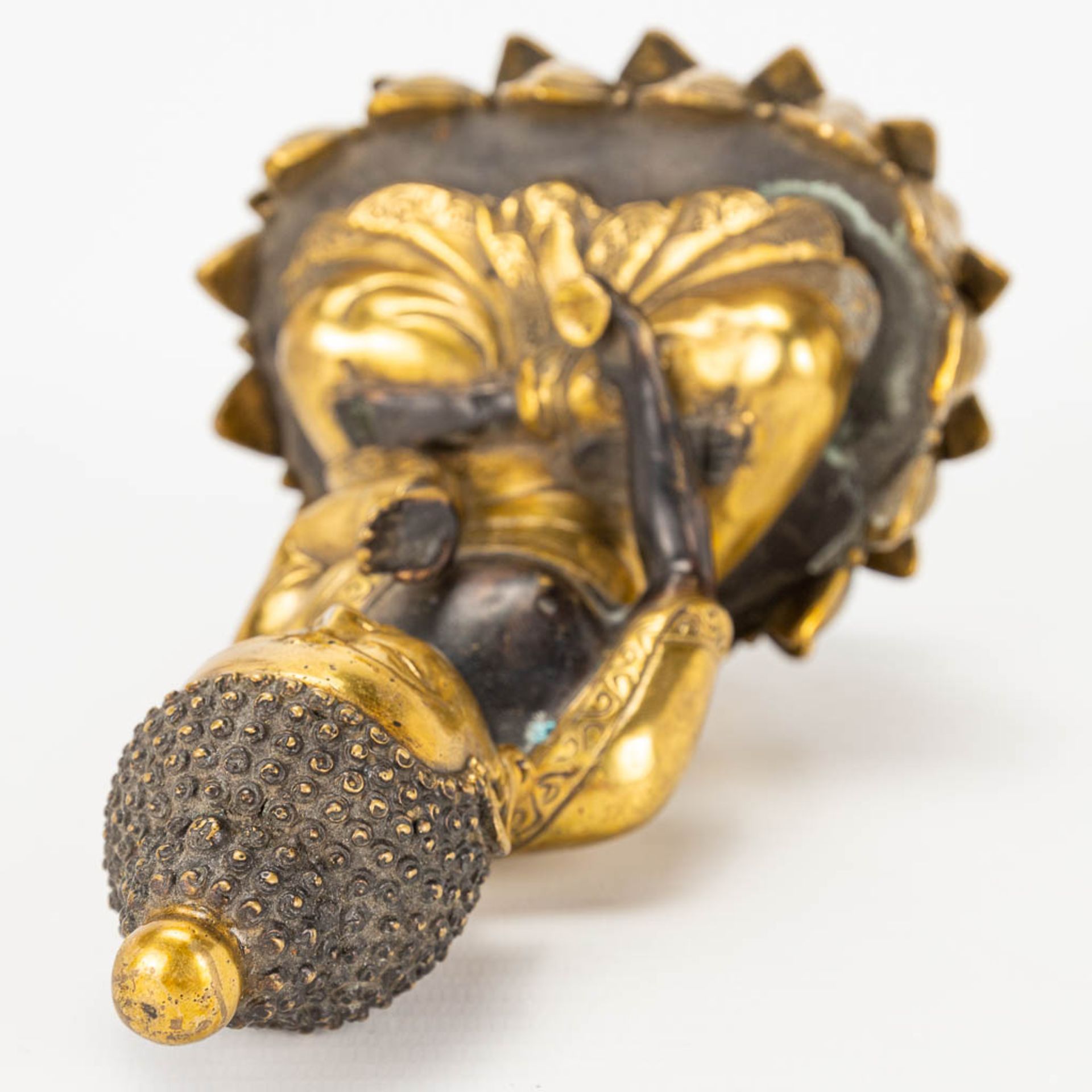 A Buddha on a lotus flower made of bronze. - Image 7 of 11