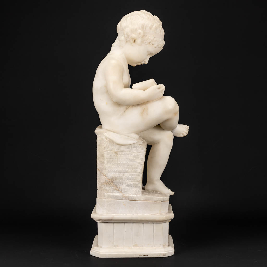 A statue of a reading boy made of alabaster. - Image 4 of 11