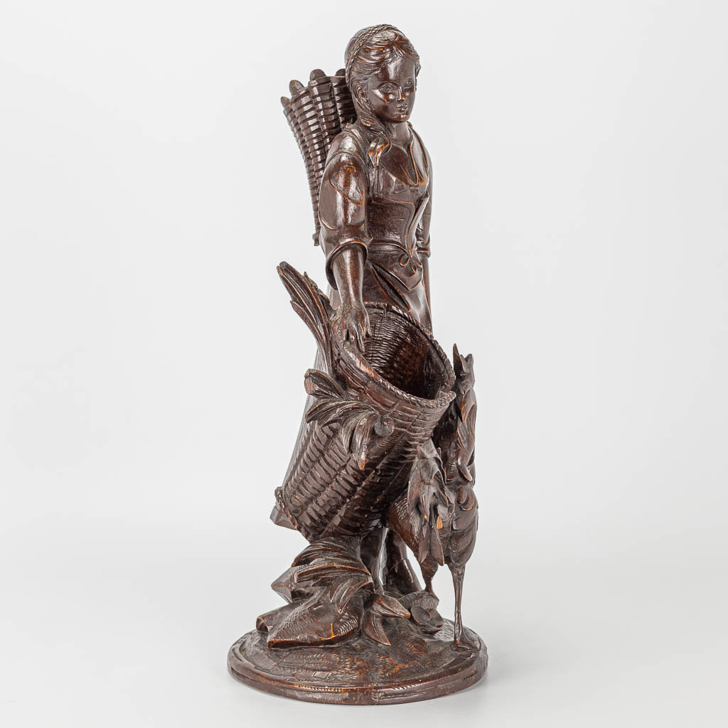 A wood sculpture of a lady with rooster, Black Forest. - Image 6 of 14