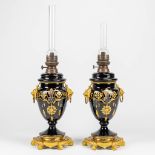 A pair of oil lamps made of glas and mounted with bronze.