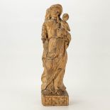 A wood sculptured Madonna with child. The first half of the 18th century.