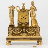 A mantle clock made of gilt bronze in empire style