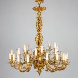 An exceptionally large and antique electrified candle chandelier with 30 points of light.