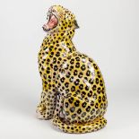 A glazed terracotta statue of a leopard, probably made in Italy.