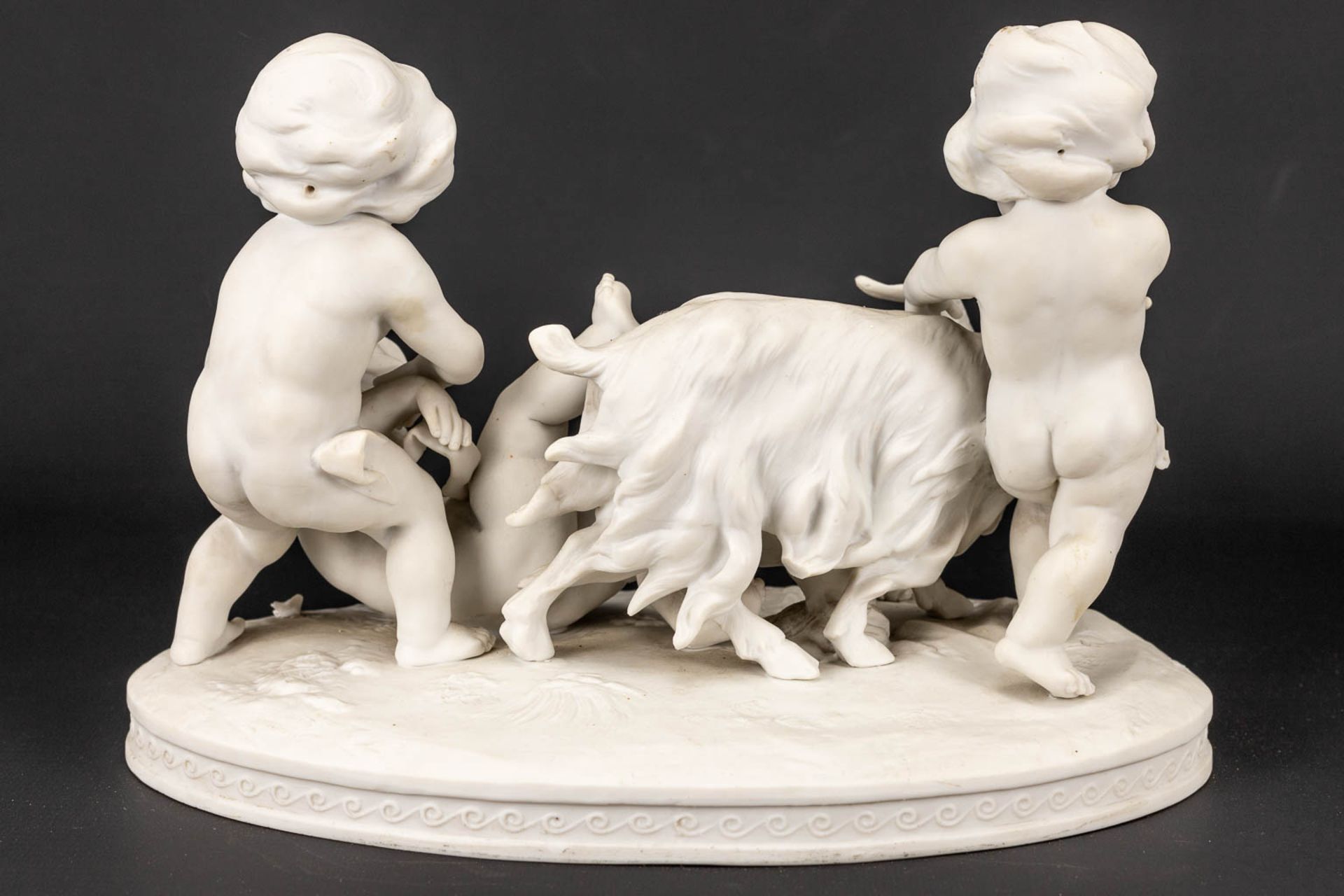 A group of kids and a goat made of biscuit porcelain and marked Richard Eckert& Co, Volkstedt. - Image 12 of 15