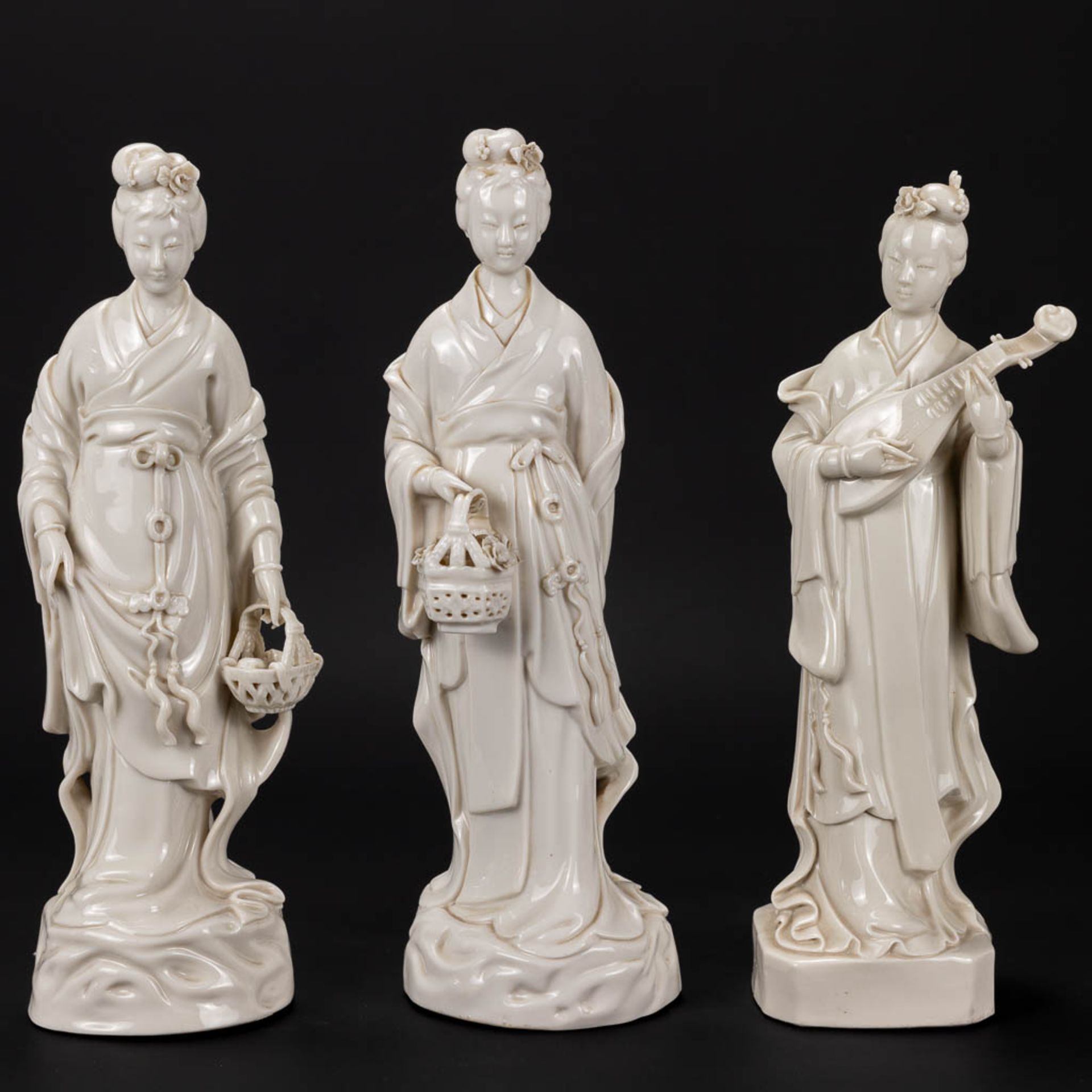 A collection of 3 female figurative statues 'Blanc De Chine' made of Chinese porcelain. - Image 10 of 16