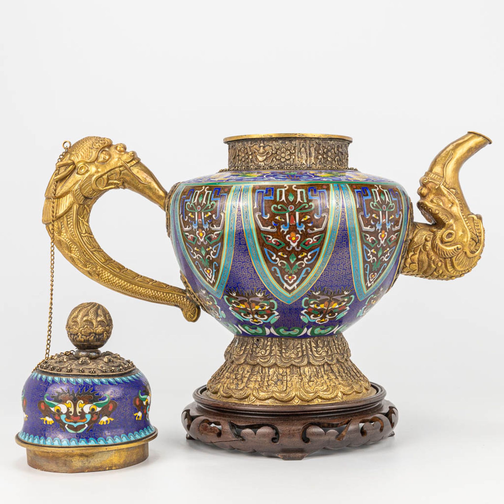 A Tibetan ceremonial ewer made of gilt bronze and finished with cloisonnŽ bronze. - Image 11 of 18