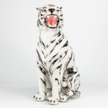 A ceramic statue of a white tiger with black stripes. Made in Italy.