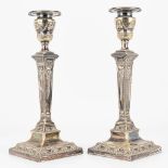 A pair of silver-plated candlesticks marked Mappin Brothers and made in England.