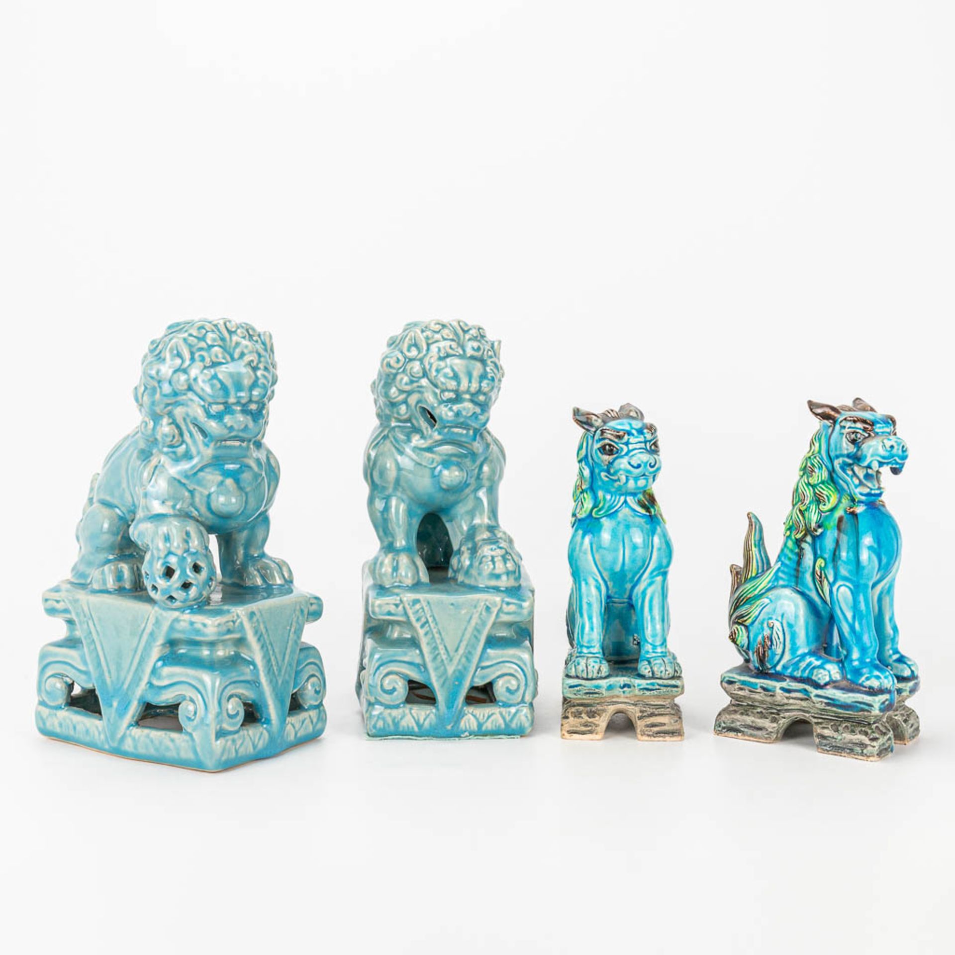 A collection of 4 Foo dogs and lions.