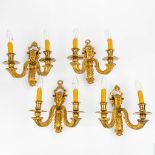 A set of 4 wall lamps made of bronze in Louis XVI style