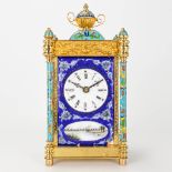 A table clock made of bronze and decorated with cloisonnŽ enamel, and a hand-painted enamel plaque.