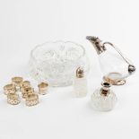 A collection of crystal and silver-plated table accessories.