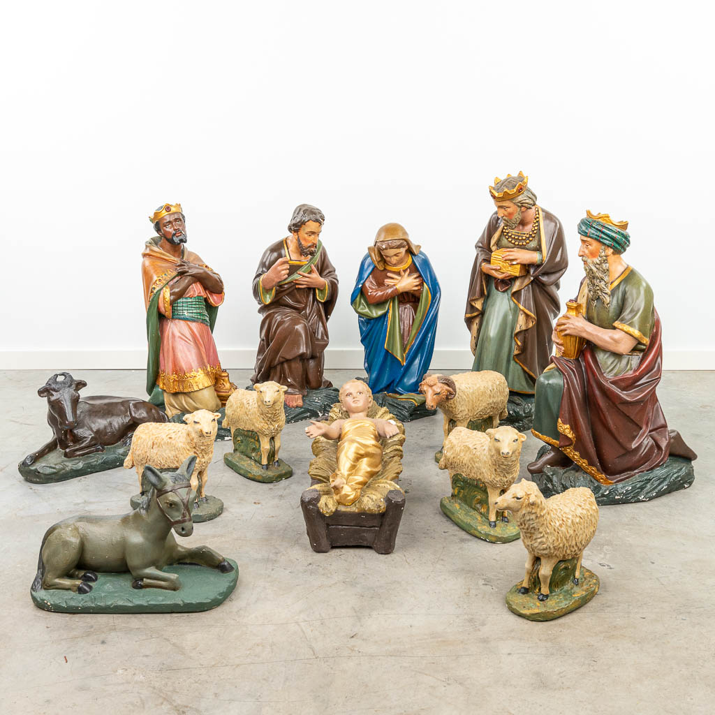 A complete and large figurative Nativity scene made of patinated plaster