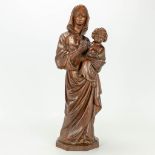 A wood sculptured statue of Madonna with child. Around 1900.