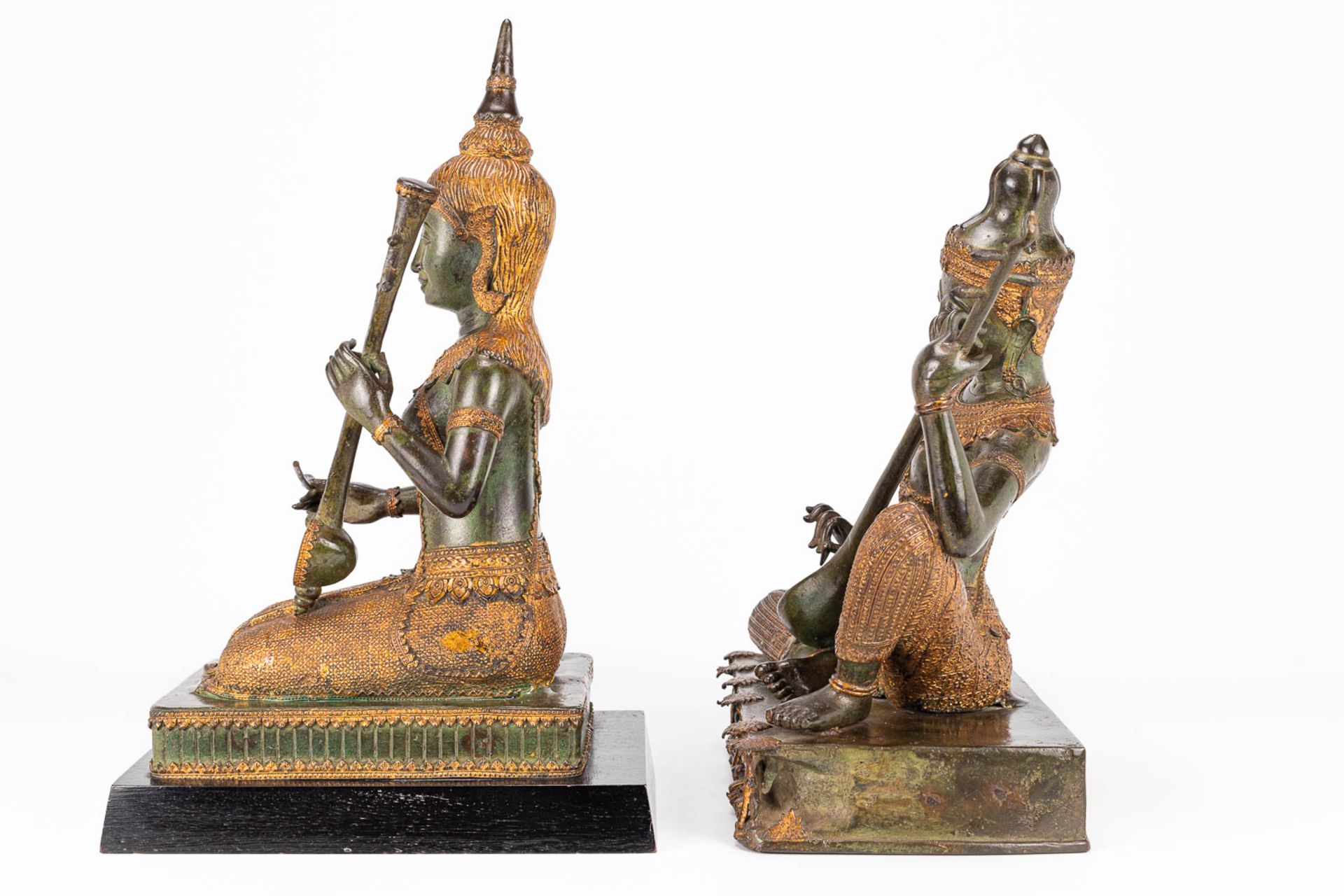 A collection of 2 oriental musical buddha's, made of metal. - Image 5 of 15