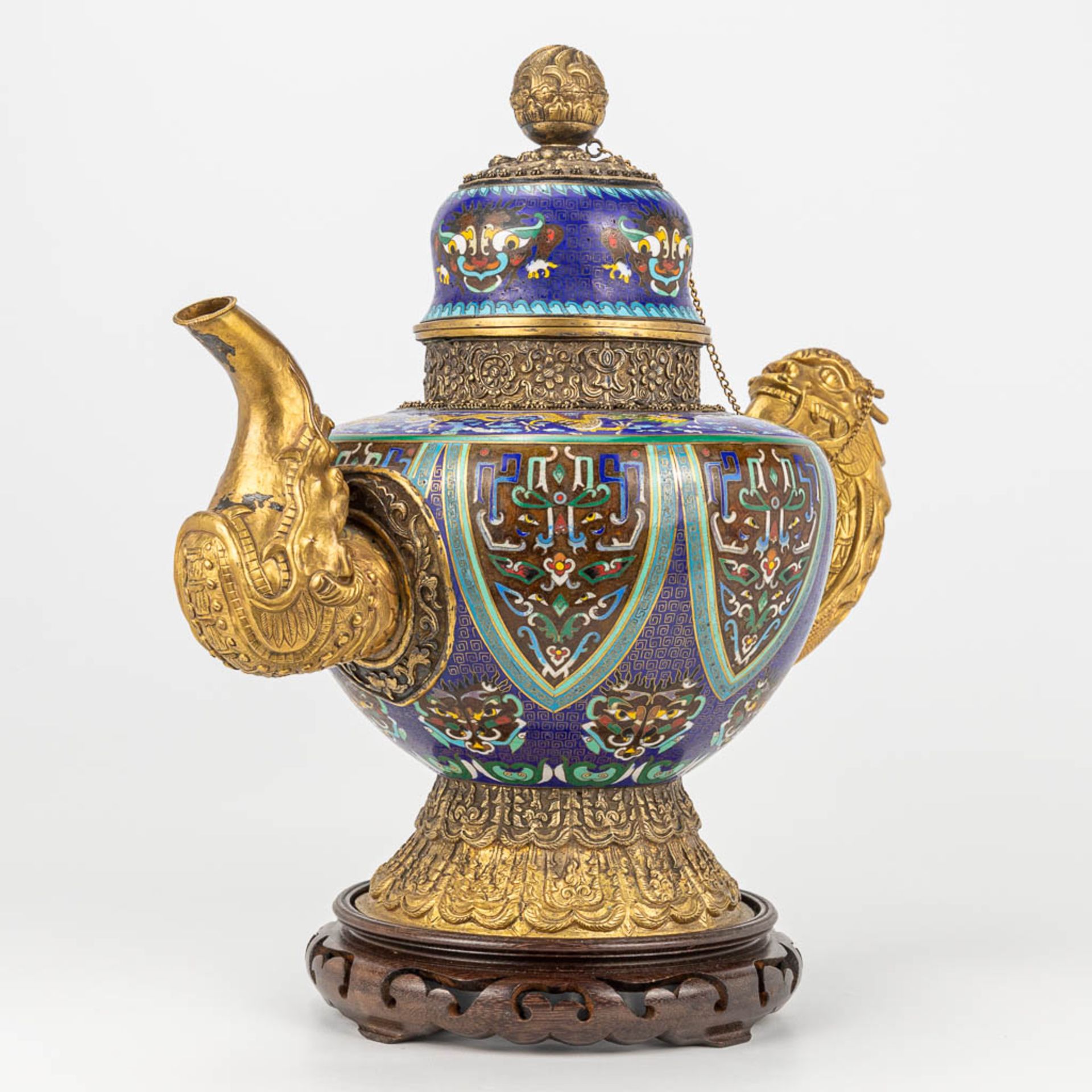 A Tibetan ceremonial ewer made of gilt bronze and finished with cloisonnŽ bronze. - Image 6 of 18