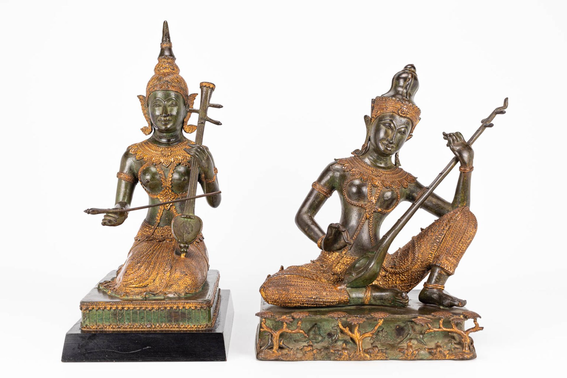 A collection of 2 oriental musical buddha's, made of metal. - Image 7 of 15