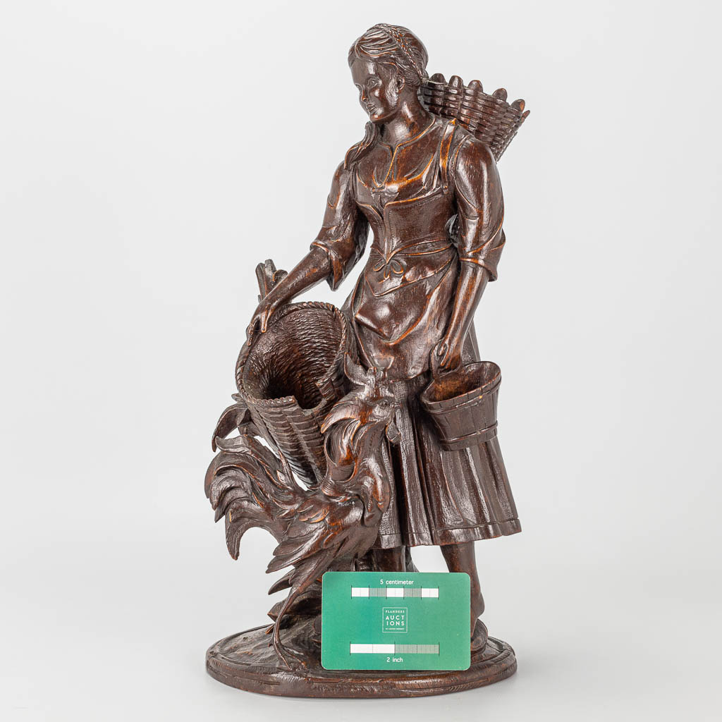 A wood sculpture of a lady with rooster, Black Forest. - Image 9 of 14