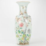 A vase made of Chinese porcelain and decorated with roses and bats. 19th century.