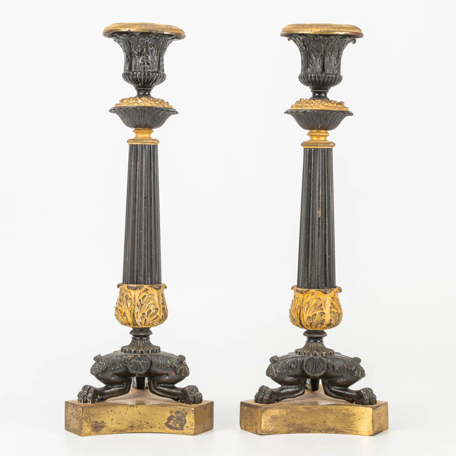 A pair of candlesticks made of gilt and patinated bronze in empire style. - Image 3 of 7