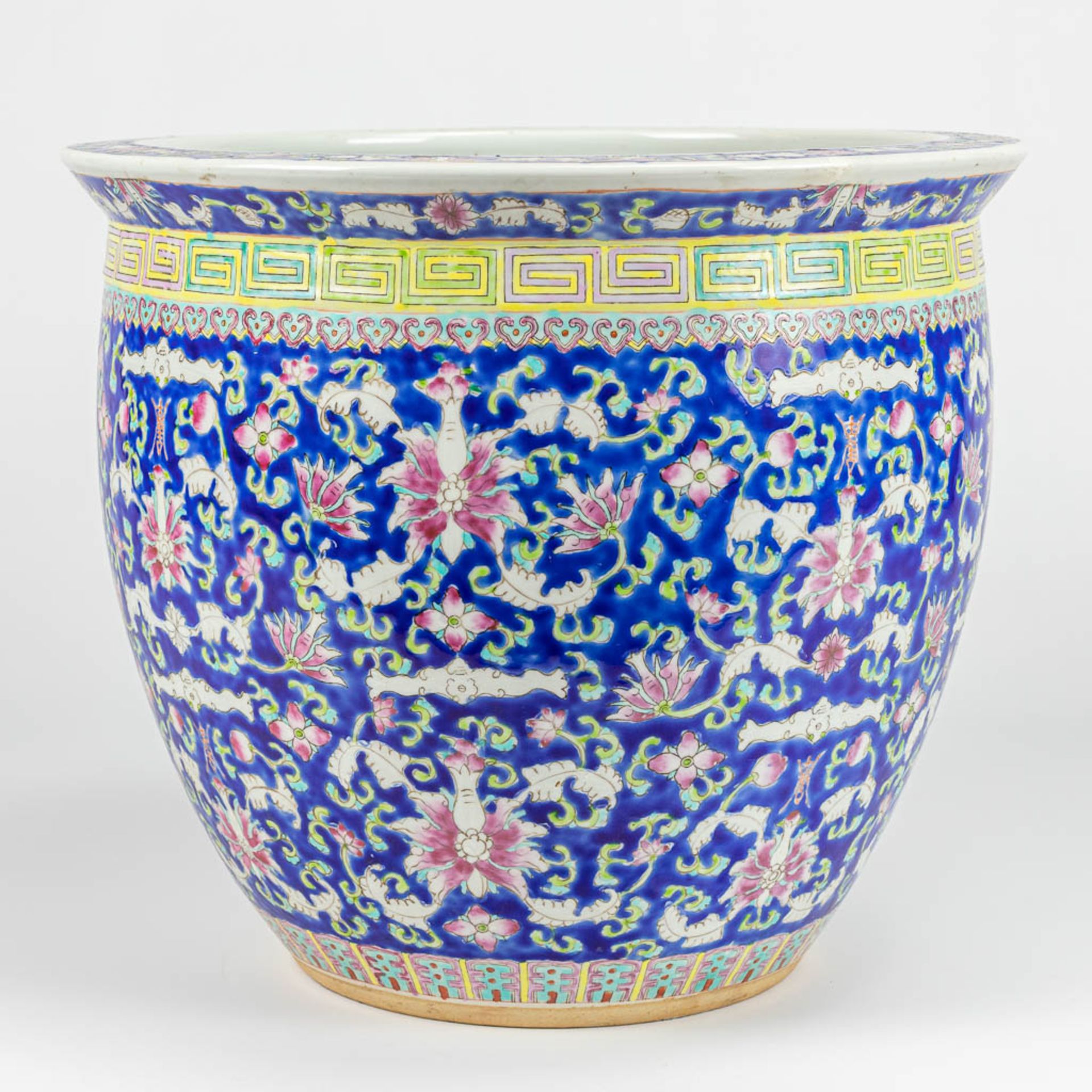 A large cache-pot made of Chinese porcelain and decorated with flowers