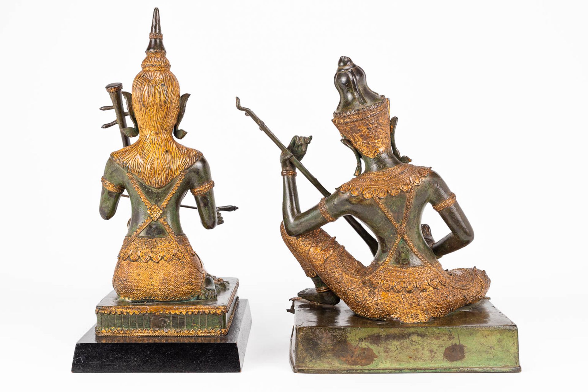 A collection of 2 oriental musical buddha's, made of metal. - Image 13 of 15